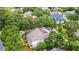 Aerial view of home with lush trees and well-maintained landscaping at 1018 E Highland Dr, Lakeland, FL 33813