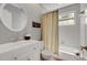 Cozy bathroom featuring a single sink vanity and a shower-tub combination at 1018 E Highland Dr, Lakeland, FL 33813