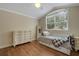 Cozy bedroom with a large window, letting in plenty of natural light at 1018 E Highland Dr, Lakeland, FL 33813