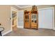 Bedroom with hardwood floors, built-in shelving, and a staircase view at 1018 E Highland Dr, Lakeland, FL 33813