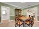 Elegant dining room featuring hardwood table, chairs, china cabinet, and staircase access at 1018 E Highland Dr, Lakeland, FL 33813