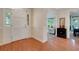 Inviting foyer featuring hardwood floors and a white front door with sidelights at 1018 E Highland Dr, Lakeland, FL 33813