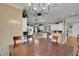 Spacious kitchen and dining area featuring granite countertops, wood flooring, and ample lighting at 1018 E Highland Dr, Lakeland, FL 33813