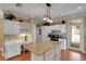 Spacious kitchen with a large island, white cabinets, and modern appliances at 1018 E Highland Dr, Lakeland, FL 33813