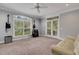 Bright room with large windows, french doors, plush carpet, and musical instruments at 1018 E Highland Dr, Lakeland, FL 33813