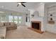 Inviting living room with a fireplace and built-in shelving, perfect for relaxing at 1018 E Highland Dr, Lakeland, FL 33813