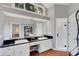 Bright main bathroom with dual sinks, black granite counters, and a walk-in shower at 1018 E Highland Dr, Lakeland, FL 33813