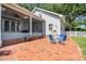 A charming brick patio with outdoor seating, ideal for relaxation and gatherings at 1018 E Highland Dr, Lakeland, FL 33813