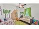 Another view of this shared bedroom with playful wall decor and two twin beds at 1044 Timbers Dr, Fort Meade, FL 33841