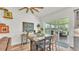Cozy dining area with access to an outdoor patio overlooking a serene landscape at 1044 Timbers Dr, Fort Meade, FL 33841