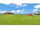Expansive lot with lush greenery featuring the house and a shed on the property at 1044 Timbers Dr, Fort Meade, FL 33841