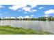Picturesque water view of the lake surrounded by lush greenery at 1044 Timbers Dr, Fort Meade, FL 33841
