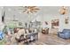 Spacious living room with high ceilings, wood floors, ample seating, and an open floor plan into the kitchen at 1044 Timbers Dr, Fort Meade, FL 33841