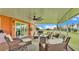 Spacious screened-in patio area with ample seating and views of the backyard and surrounding landscape at 1044 Timbers Dr, Fort Meade, FL 33841