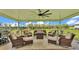 Another view of the relaxing screened patio featuring comfortable seating and tranquil backyard views at 1044 Timbers Dr, Fort Meade, FL 33841