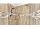 Detailed view of a tiled shower featuring dual shower heads and recessed shelving for storage at 1044 Timbers Dr, Fort Meade, FL 33841