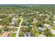 An aerial view of a neighborhood with mature trees and well-maintained streets at 1102 Berkley Ln, Winter Haven, FL 33880