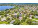 An aerial view of a residential neighborhood with well-kept lawns and mature trees at 1102 Berkley Ln, Winter Haven, FL 33880