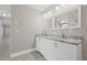 Bright bathroom featuring double vanity with granite countertops at 1102 Berkley Ln, Winter Haven, FL 33880