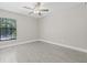 This bedroom has wood-look flooring and a modern ceiling fan offering both style and comfort at 1102 Berkley Ln, Winter Haven, FL 33880