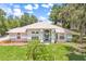 Picture of a charming home with a well-manicured lawn and mature trees at 1102 Berkley Ln, Winter Haven, FL 33880