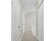 Hallway with tile floors leading to the bathroom and closet at 1102 Berkley Ln, Winter Haven, FL 33880