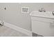 This laundry room has a utility sink, complete with hot and cold water connections at 1102 Berkley Ln, Winter Haven, FL 33880