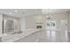 Well-lit room with modern appliances, a fireplace, and backyard views at 1102 Berkley Ln, Winter Haven, FL 33880