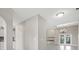 Open-concept living space showcasing the kitchen and living room fireplace at 1102 Berkley Ln, Winter Haven, FL 33880