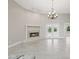 Living room with a cozy fireplace and access to outdoor patio at 1102 Berkley Ln, Winter Haven, FL 33880