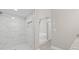 Walk-in shower with tile surround and built-in niche at 1102 Berkley Ln, Winter Haven, FL 33880