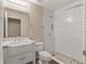 Bright bathroom featuring a white vanity, hexagon tile floors, and a white subway tile shower at 1125 Blackjack Ridge St, Minneola, FL 34715
