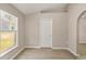 Cozy bedroom featuring a window and modern tiled floors with neutral paint at 1125 Blackjack Ridge St, Minneola, FL 34715