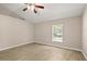 Neutral bedroom with a window and ceiling fan with modern tiled floors at 1125 Blackjack Ridge St, Minneola, FL 34715