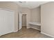 Bedroom with attached desk, closet and tiled flooring at 1125 Blackjack Ridge St, Minneola, FL 34715
