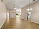 Spacious living room boasting tile floors, neutral walls, decorative lighting, and arched doorways at 1125 Blackjack Ridge St, Minneola, FL 34715