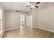 Spacious main bedroom features modern tiled floors and access to the bathroom at 1125 Blackjack Ridge St, Minneola, FL 34715