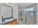 This full bathroom features a stand up shower, vanity and is brightly lit at 141 Minniehaha Cir, Haines City, FL 33844