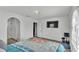This bedroom features neutral carpet, light walls, large window and is brightly lit at 141 Minniehaha Cir, Haines City, FL 33844