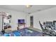 Bright bedroom features comfortable gaming setup, walk-in closet, and neutral paint at 141 Minniehaha Cir, Haines City, FL 33844
