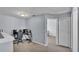Neutral carpet leads to bedroom, office nook and closet in this versatile landing area at 141 Minniehaha Cir, Haines City, FL 33844
