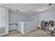 This landing area offers carpeting, neutral paint and an elevated area for an office or reading nook at 141 Minniehaha Cir, Haines City, FL 33844