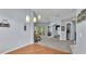 Bright and open living space with views of dining, living, and covered patio at 141 Minniehaha Cir, Haines City, FL 33844