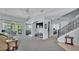 Open concept living area with carpet, leading to a patio with dining area at 141 Minniehaha Cir, Haines City, FL 33844