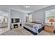 A spacious main bedroom with ensuite bath and a walk-in closet offers a tranquil retreat at 141 Minniehaha Cir, Haines City, FL 33844