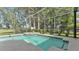 Beautiful screened-in pool and hot tub with lush landscaping at 141 Minniehaha Cir, Haines City, FL 33844