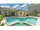 Inviting screened-in pool area, perfect for outdoor relaxation and entertaining at 141 Minniehaha Cir, Haines City, FL 33844