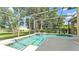 Beautiful screened in pool and hot tub, perfect for outdoor enjoyment at 141 Minniehaha Cir, Haines City, FL 33844