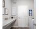 Well-organized laundry room featuring a countertop, storage cabinets, and a washing machine at 1449 Fleur Dr, Davenport, FL 33837
