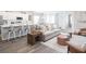 Open-concept living space featuring a kitchen island with seating, a comfortable sofa, and modern decor at 1449 Fleur Dr, Davenport, FL 33837